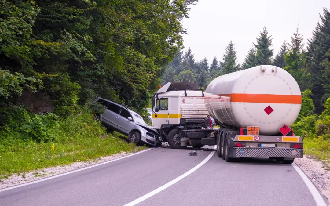 Truck and car involved in roadside collision.