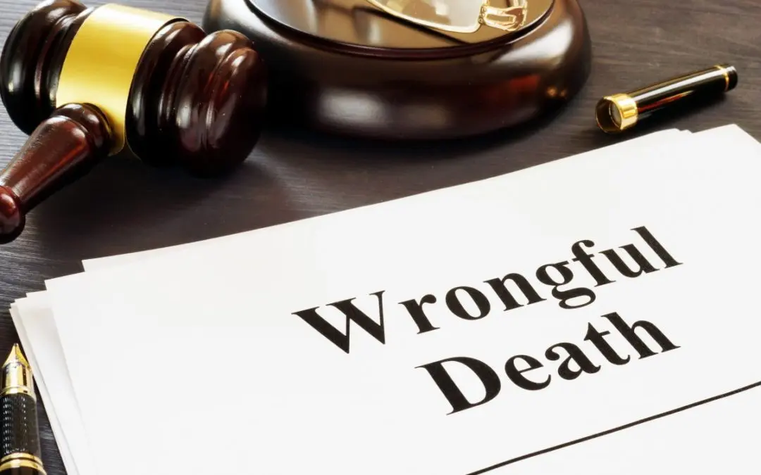 Gavel and documents labeled "Wrongful Death" visible.