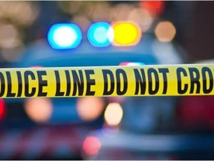 Police crime scene tape with flashing lights.