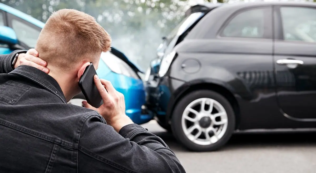 Person on phone after being involved in crash.