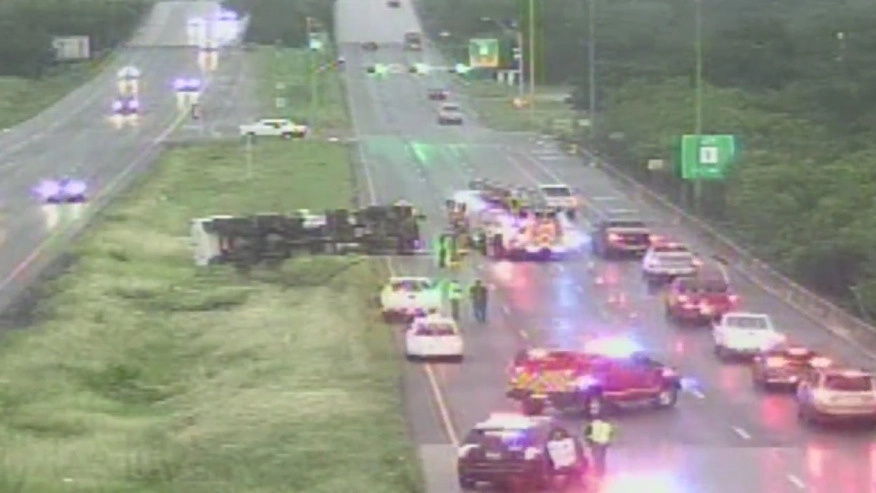 Traffic accident scene with overturned vehicle.