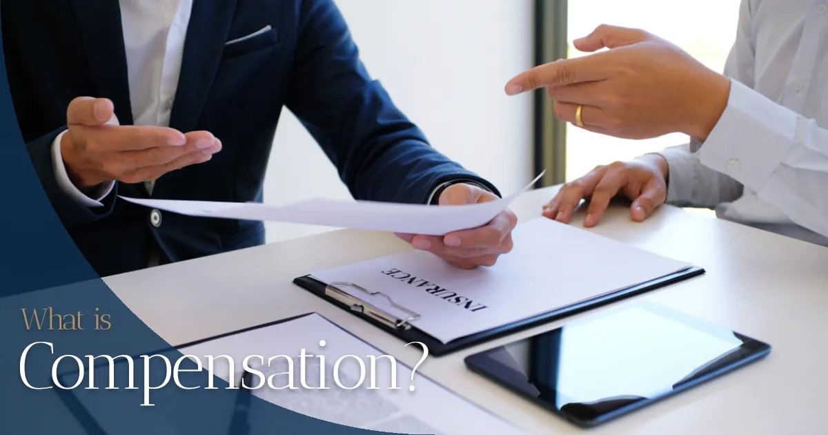 Two professionals discussing insurance compensation paperwork.
