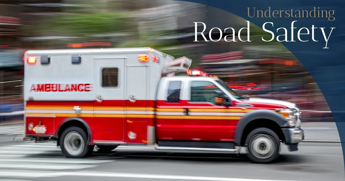 Speeding ambulance with “Understanding Road Safety” text.