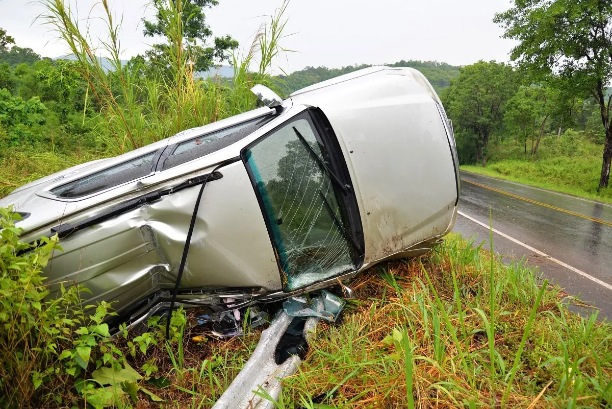 Car overturned off road after crash.