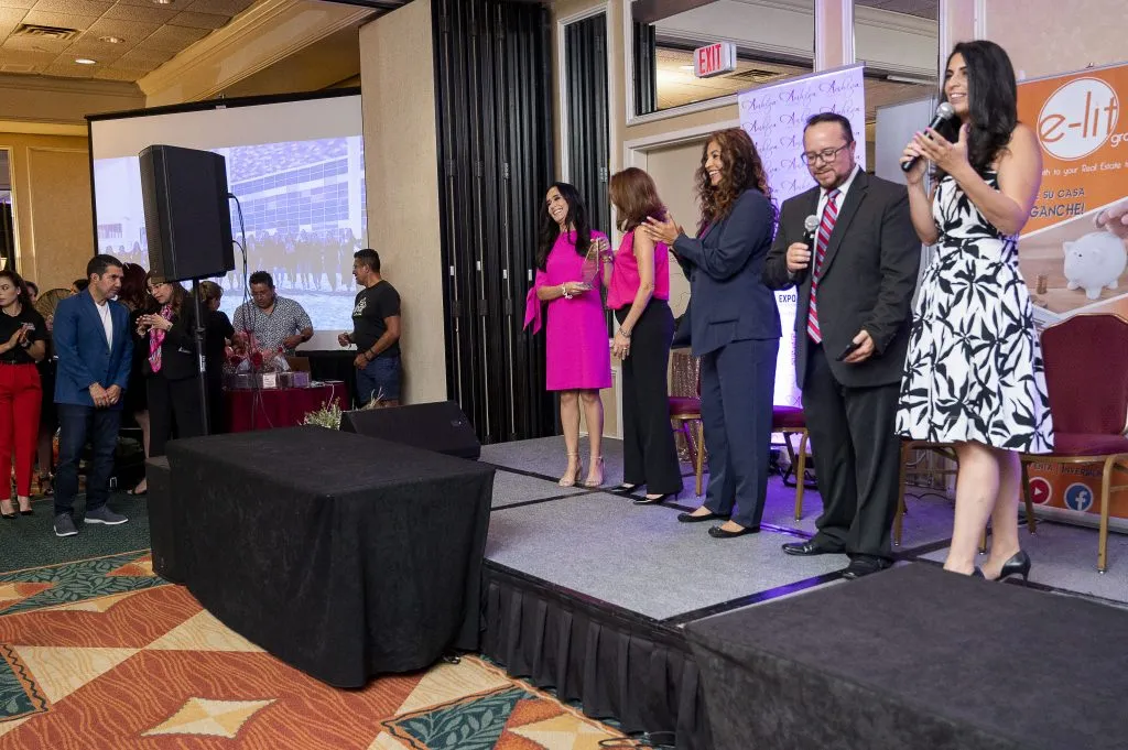 People on stage at event