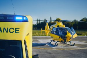 An ambulance and emergency helicopter.