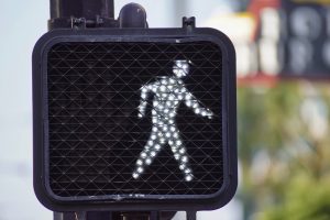 An electric "Walk" roadway sign.
